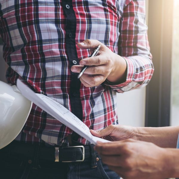 electrician reviewing licenses