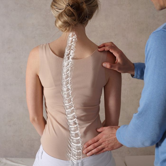 spine overlay on woman sitting