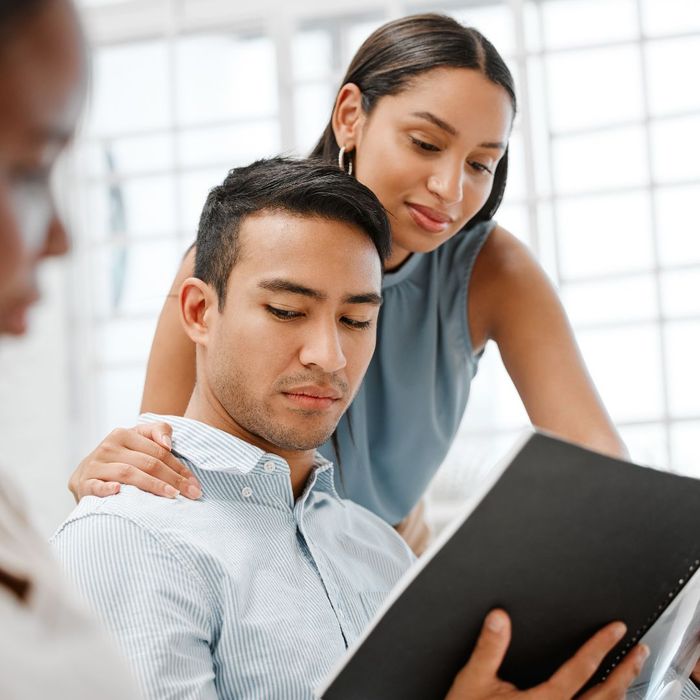 co-worker awkwardly touch shoulder of another co-worker