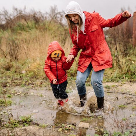 mom and child in puddle