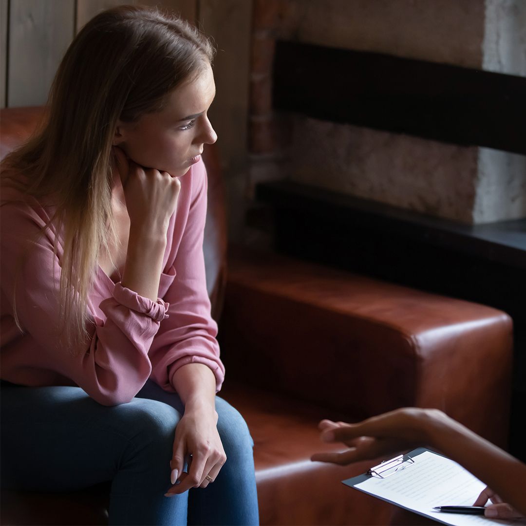 Teen sitting in a session with her therapist