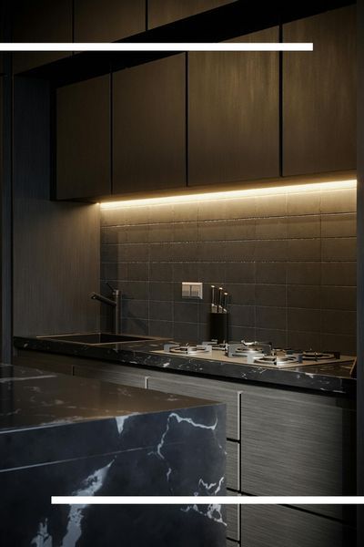 A luxury modern kitchen featuring a dark charcoal-tiled backsplash illuminated by under-cabinet LED strip lighting, paired with a black marble countertop