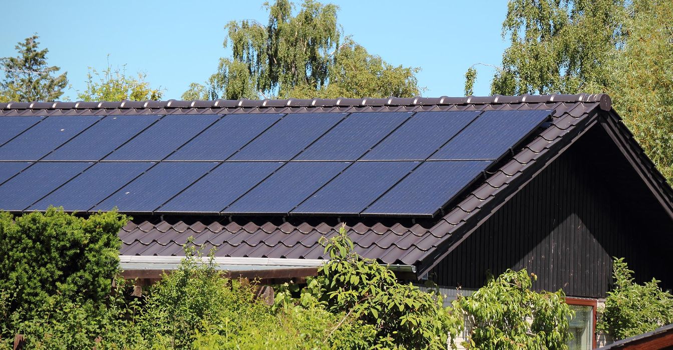 Solar panels on brown tile roof