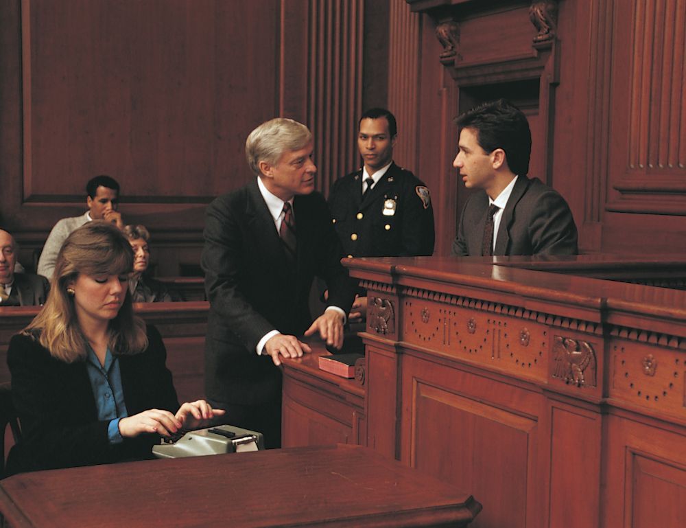 A court reporter typing during a court case