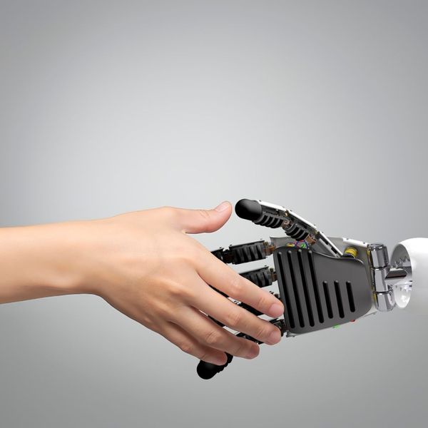 a person shaking a robots hand The Future of Deposition Court Reporting (2).jpg