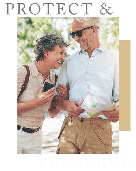 Joyful senior couple on a walk with map and phone, representing retirement adventure, wealth protection, and financial confidence Smiling retired couple exploring outdoors with map and phone, symbolizing financial freedom and lifestyle planning