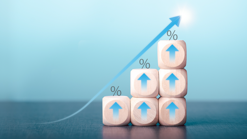 Stacked Wooden Blocks with Upward Arrows and Percent Symbols