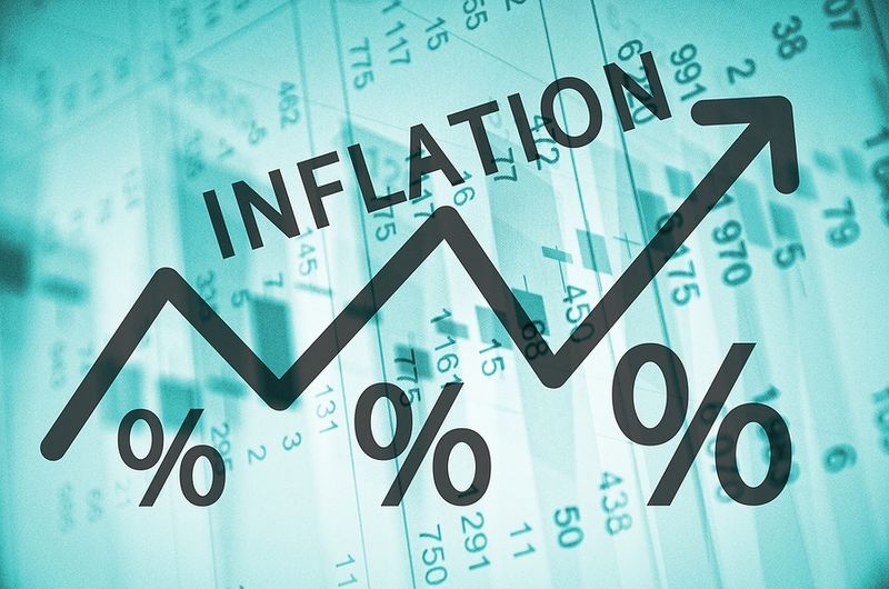 Arrow and percentage symbols rising with the word Inflation over financial data, showing price increases and economic impact