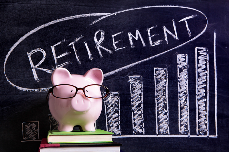 Piggy Bank with Glasses and Retirement Graph on Chalkboard