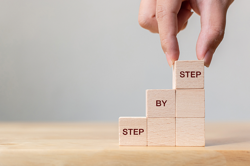 Hand Stacking Wooden Blocks with "Step by Step"