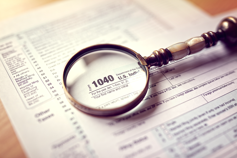 Magnifying Glass Over IRS Form 1040