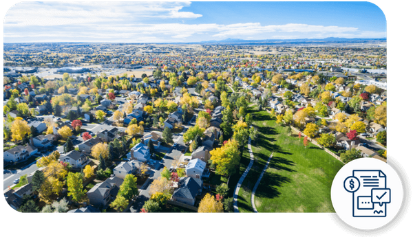 a spacious neighborhood with mountains in the distance behind it