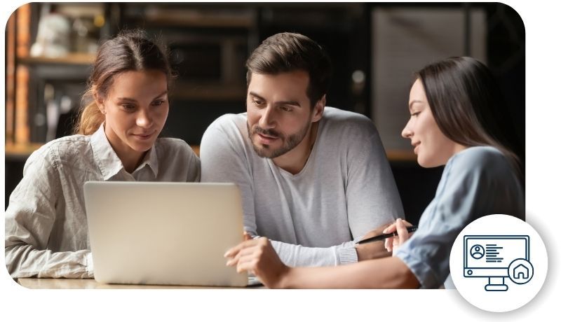 a couple looking at a computer with a broker