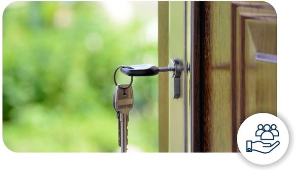 A set of keys hanging from a door