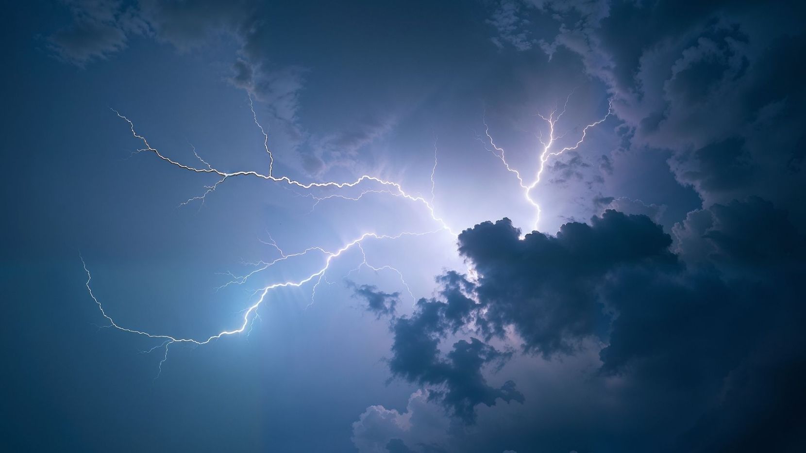 Dramatic lightning flash across a dark storm sky