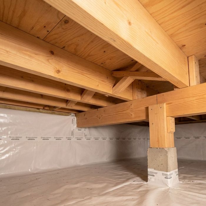 Sturdy, dry wooden floor joists demonstrating excellent structural integrity after professional moisture control services.