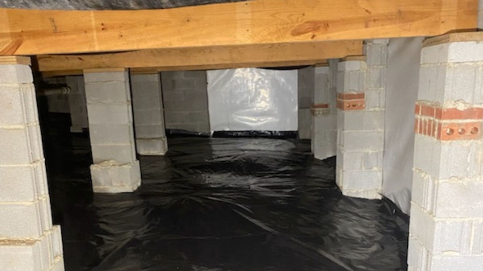 Crawl space insulation and wooden planks