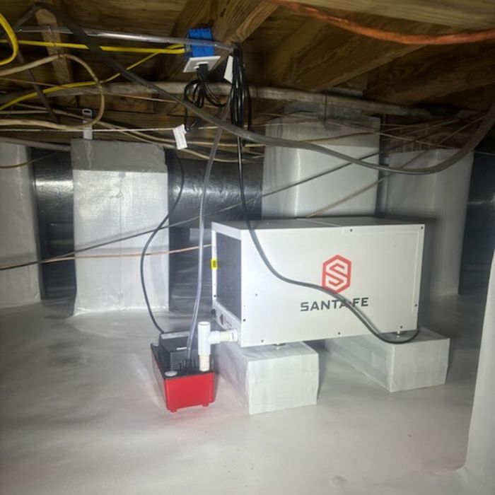 Modern HVAC unit operating efficiently within a fully sealed and encapsulated residential crawl space.