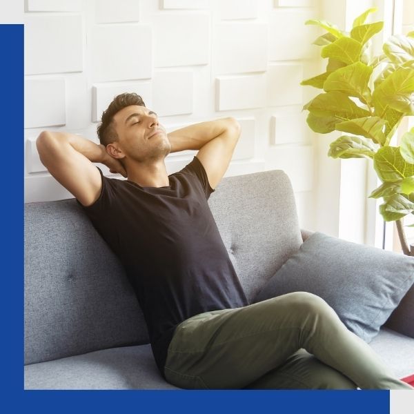 man breathing deeply in his home man breathing deeply in his home