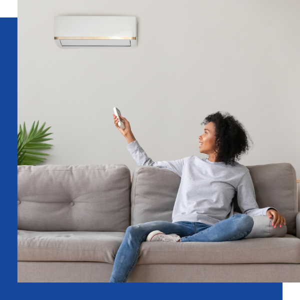 Woman enjoying new ac unit in home by Alpha Comfort Systems. Tallmadge, OH1.png