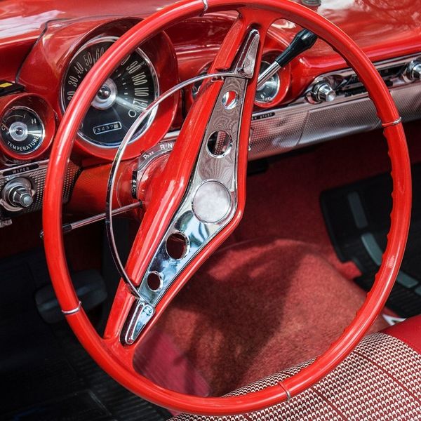 red steering wheel in a vintage car