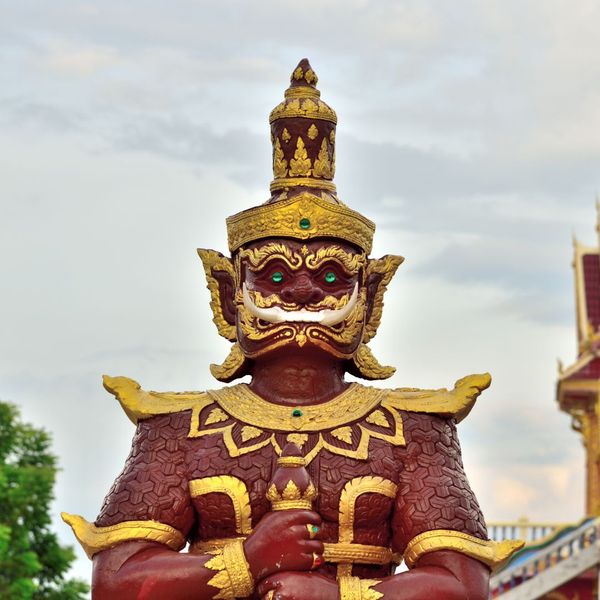 close up image of a red and gold statue