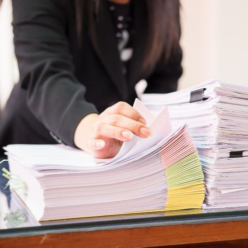 woman combing through files