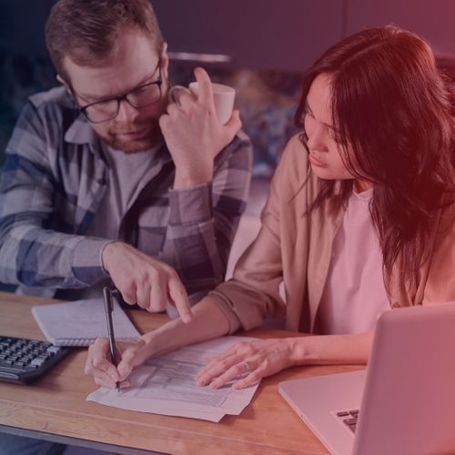 couple looking at expenses couple looking at expenses