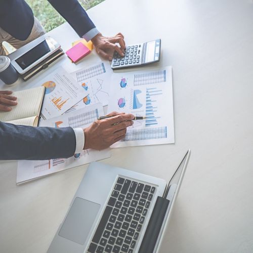 business team looking though financials business team looking though financials