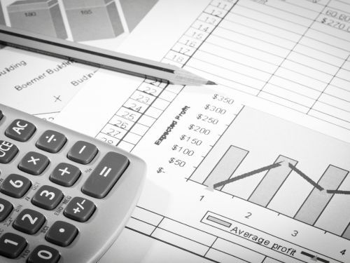calculator sits on a financial statement with a chart Thomasville 4.jpg