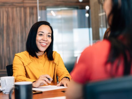 woman smiles at person sitting across table Thomasville 2.jpg