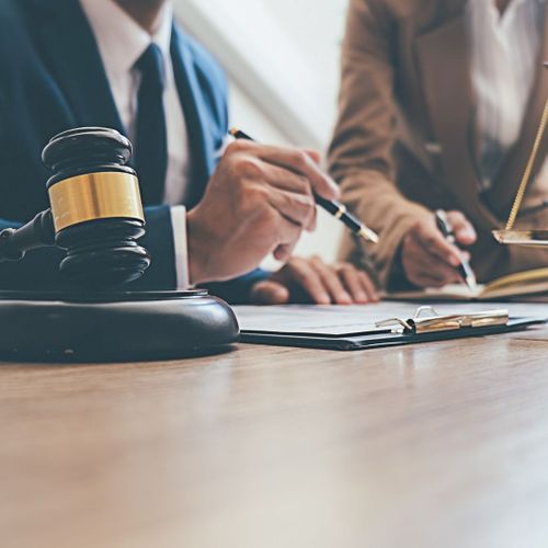 lawyer working with a client lawyer working with a client