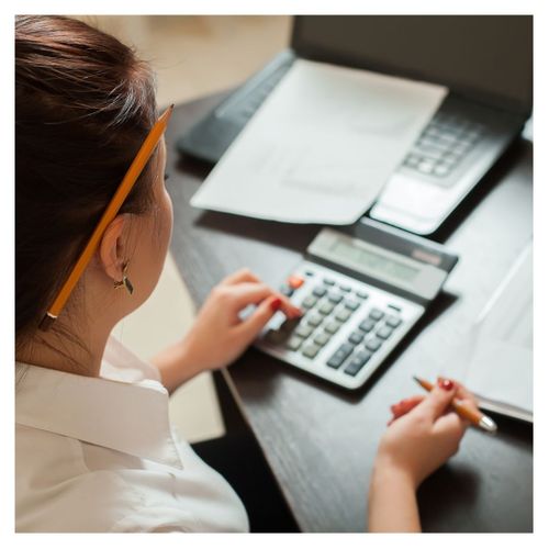 professional bookkeeper using calculator