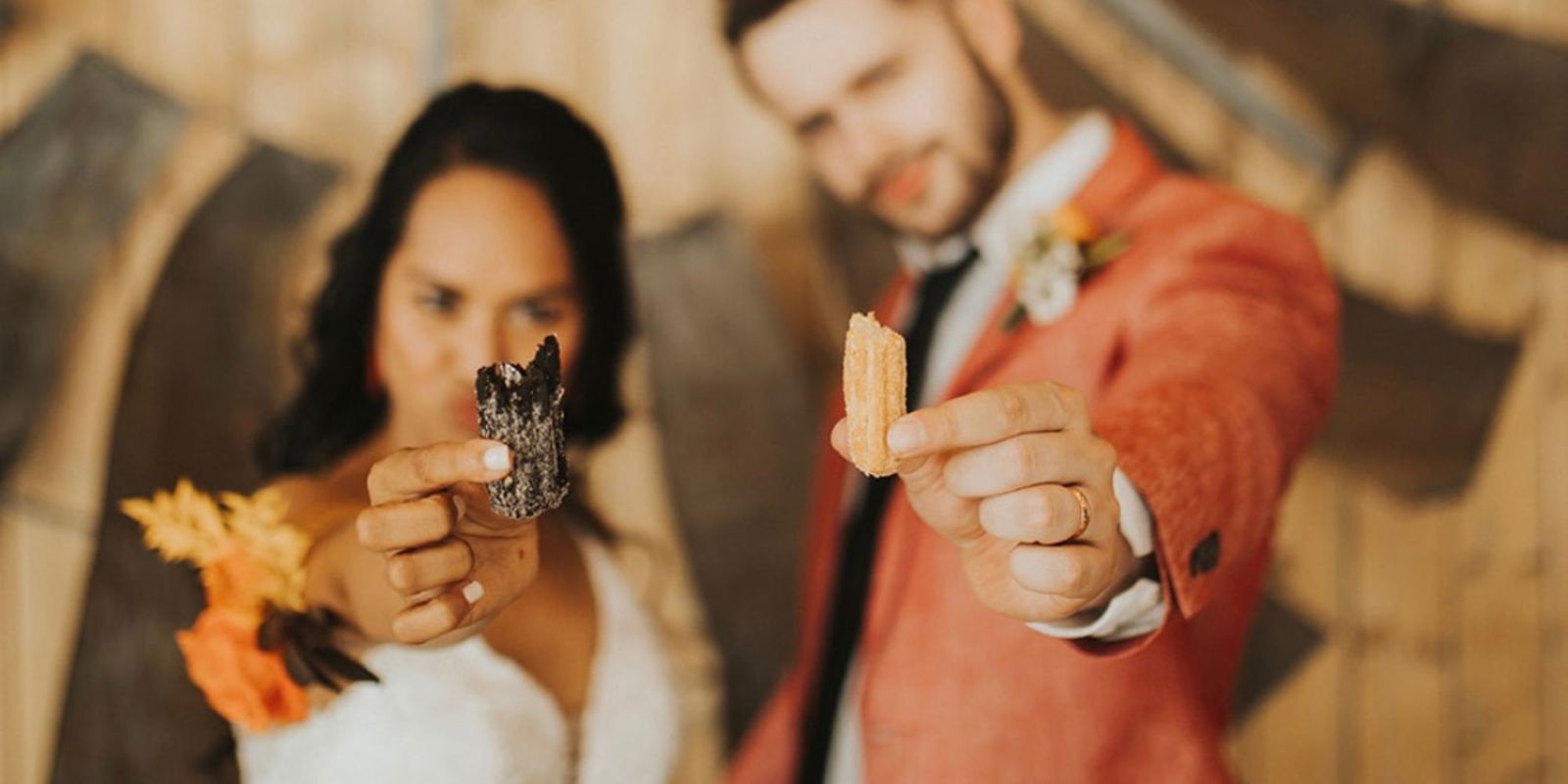 Wedding couple holding churros