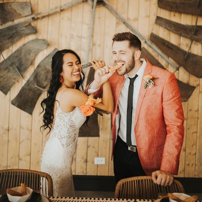 bride and groom eating churros