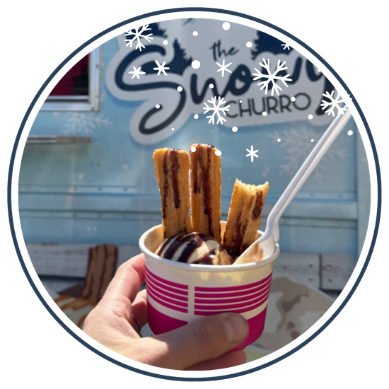 Holding up churro treat 