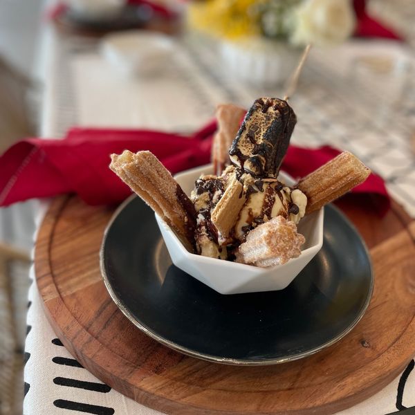 a bowl of churros with toppings