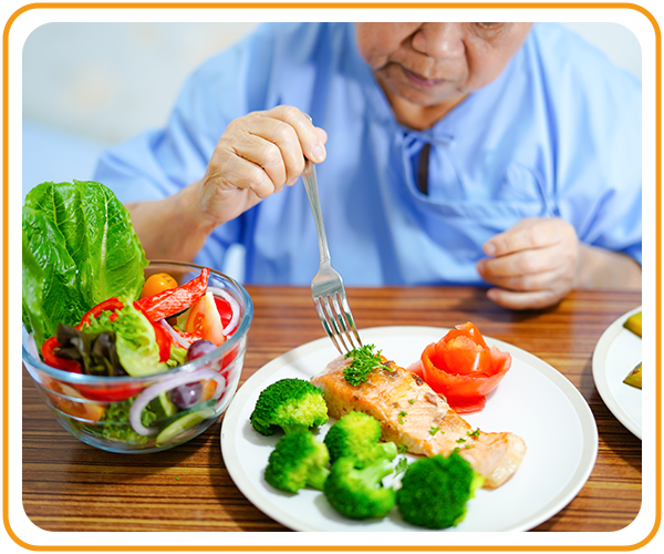 elderly woman eating healthy meal