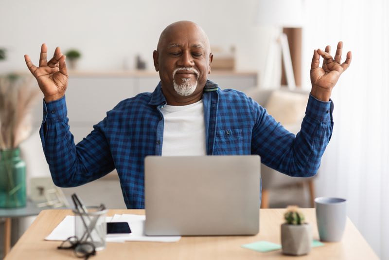 elderly man using laptop