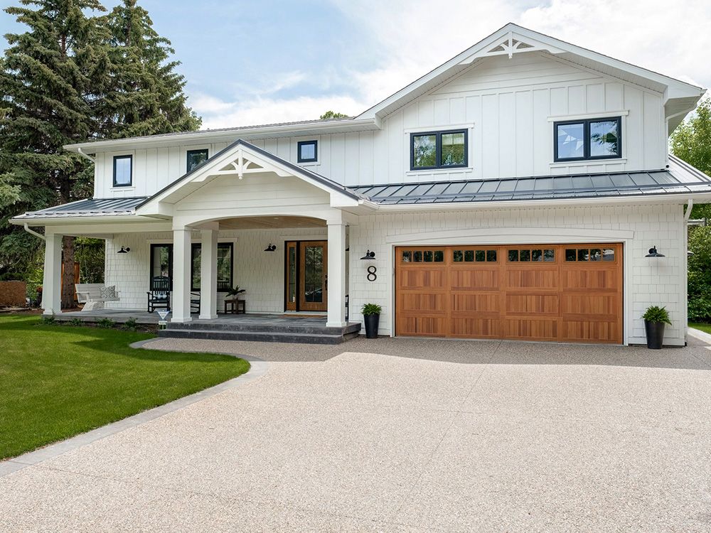 Modern garage door on white house