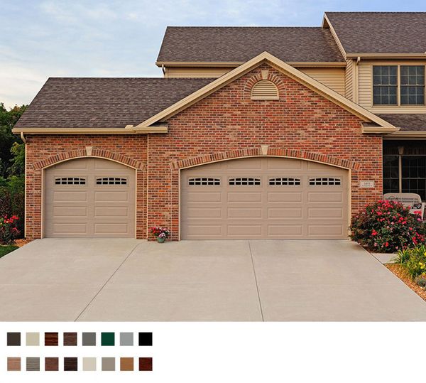 Brick house with arched garage doors