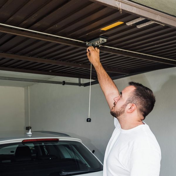 Man opening his garage manually