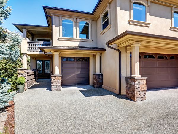 Modern house with brown garage doors