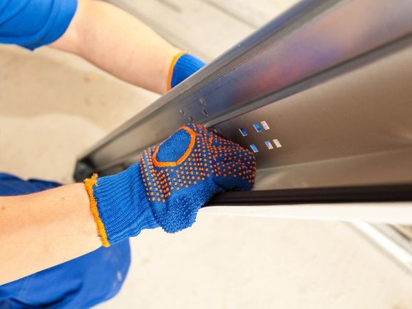 person fixing garage door