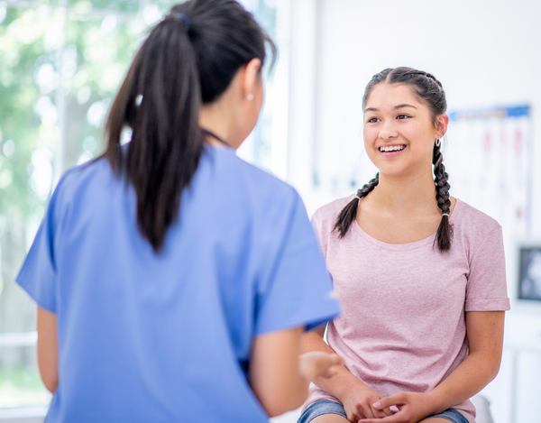 nurse talking to teenager