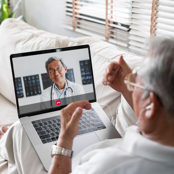 man talking to doctor about mental health in virtual appointment