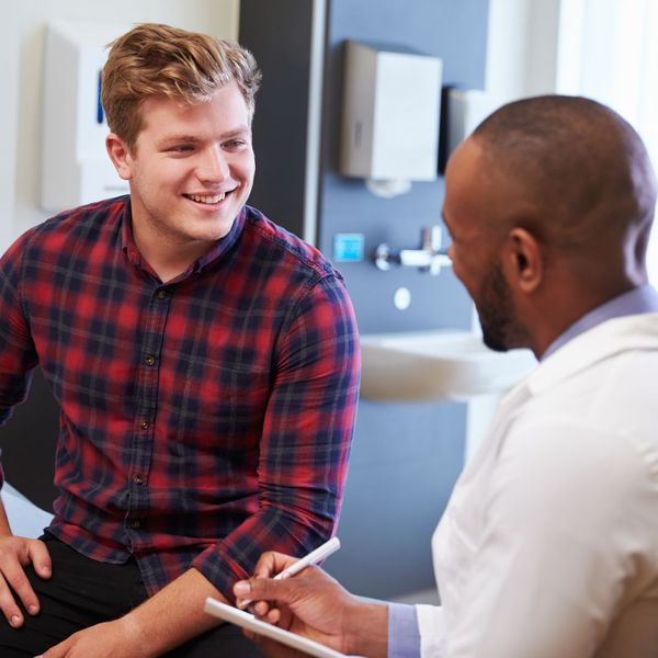 young man smiling at doctor