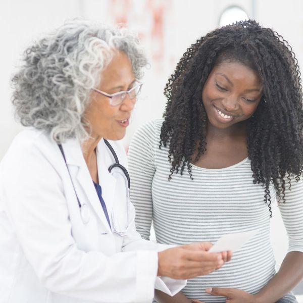doctor talking with a pregnant woman