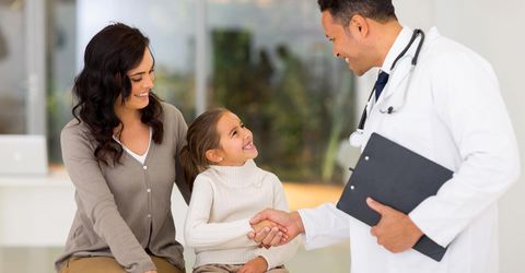 Mother and daughter with doctor