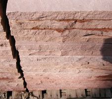 Side view of red stones that have been cut